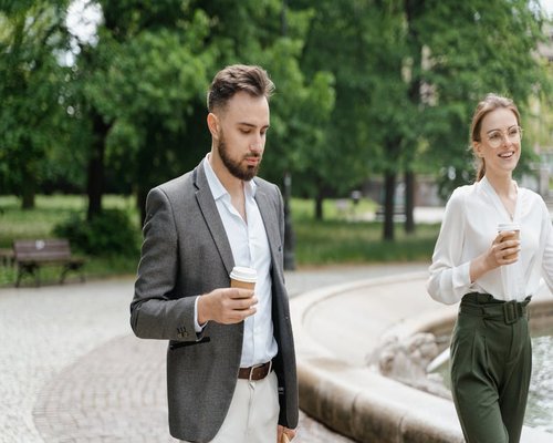 person taking a short walk in a park during lunch break